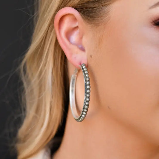 Worn Silver Trimmed Hoop Earring